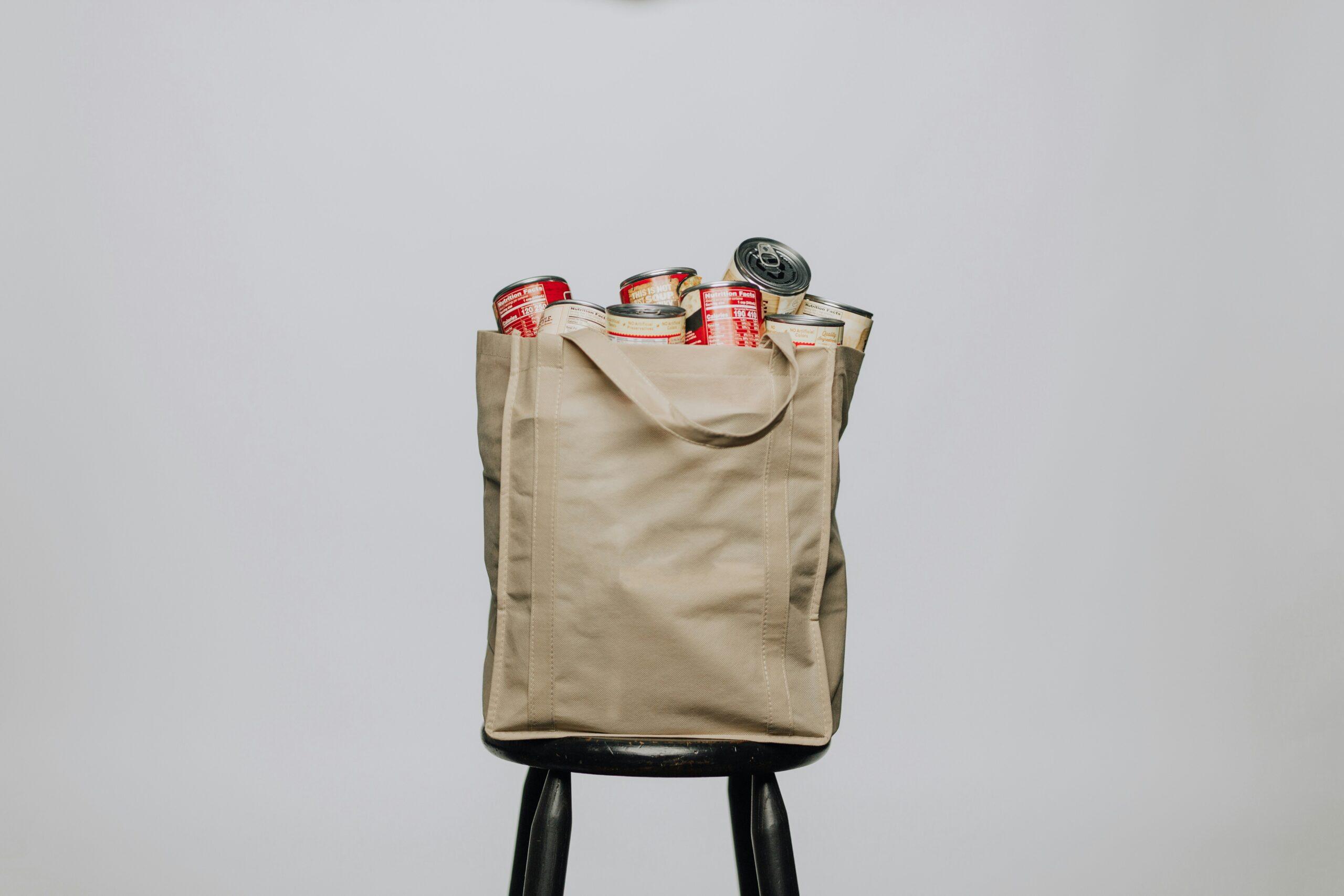 A neatly packed surfboard bag with additional accessories stacked inside