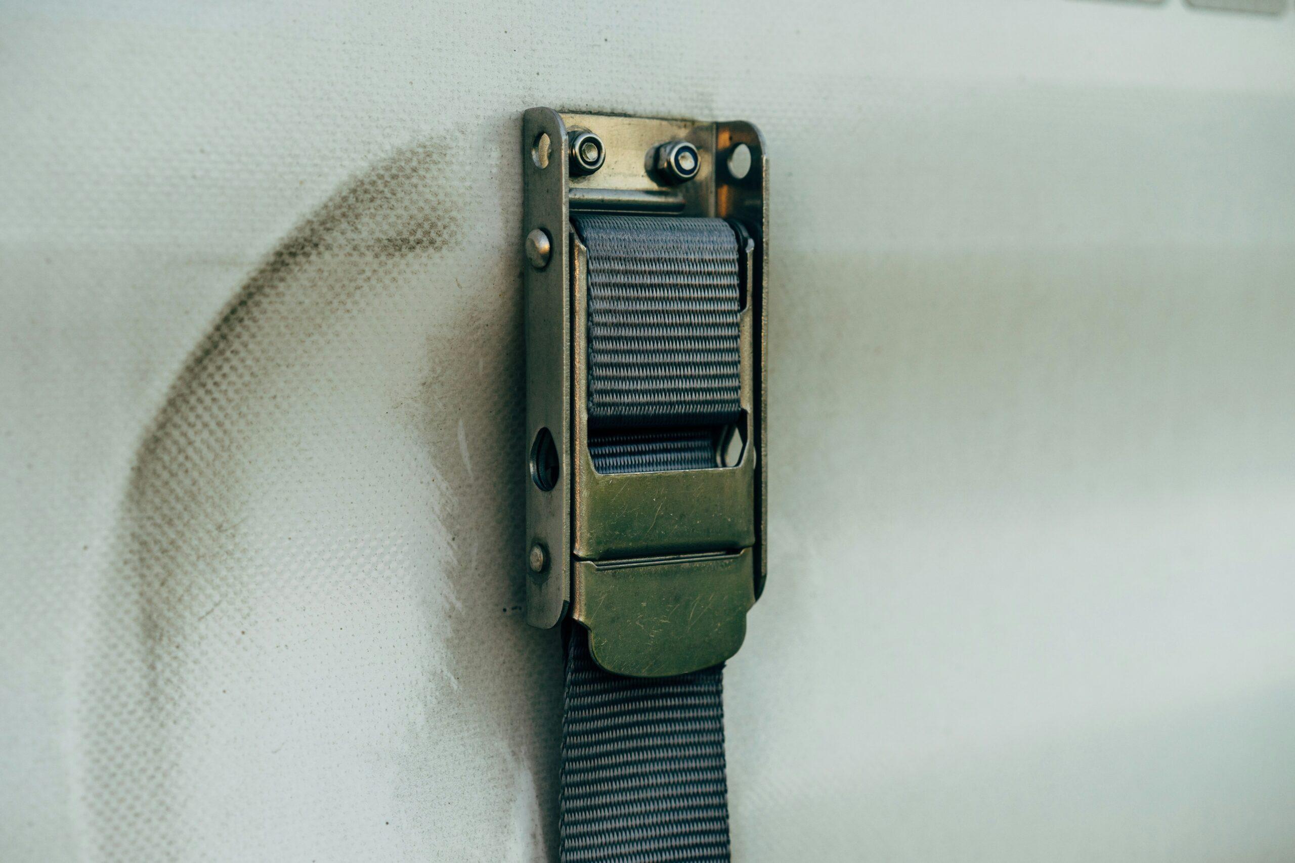 Close-up of a cam-lock buckle on a surfboard strap