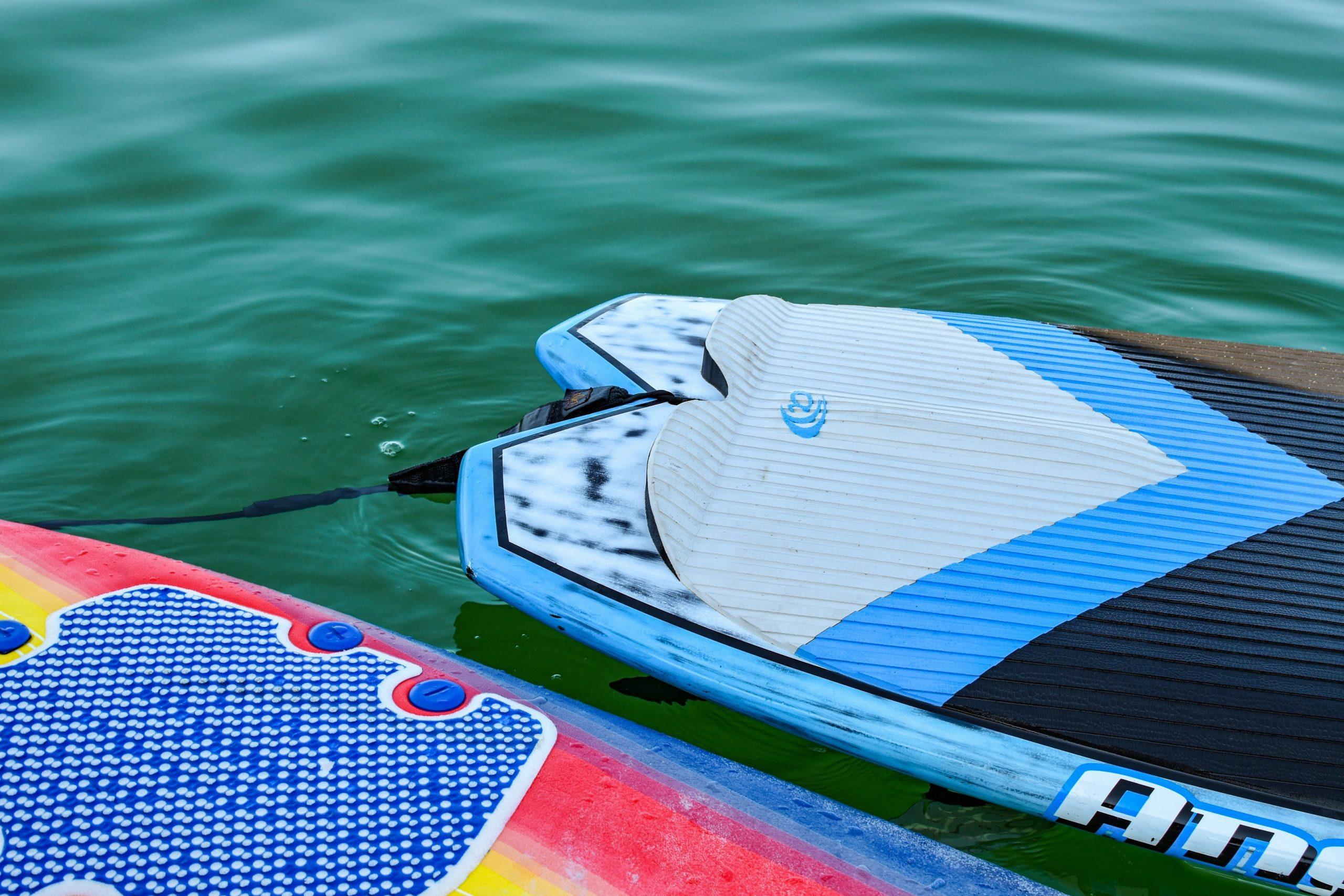 A damaged surfboard with visible cracks