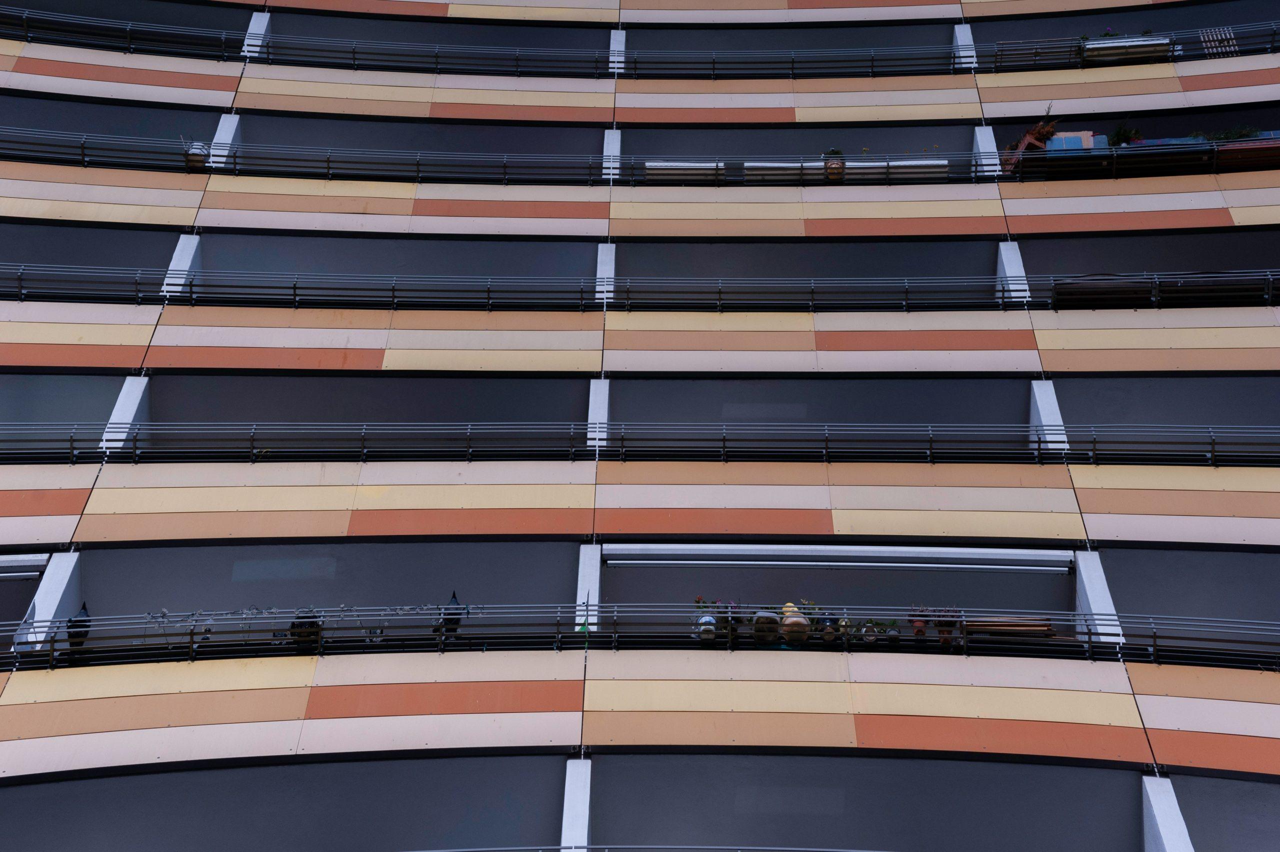 Surfer loading boards onto a car roof rack