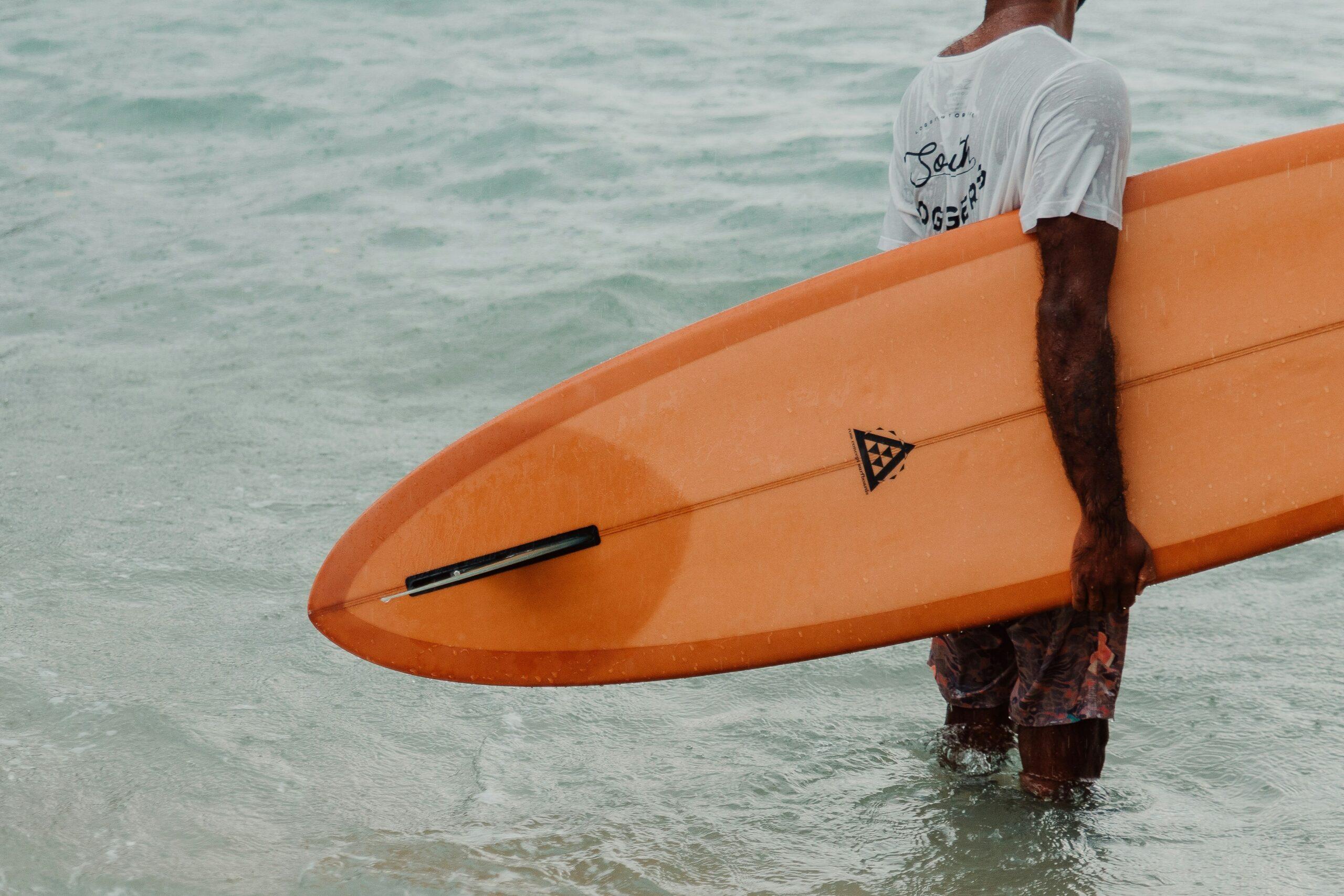 Close-up view of a padded waterproof surfboard cover highlighting durable material and protective features