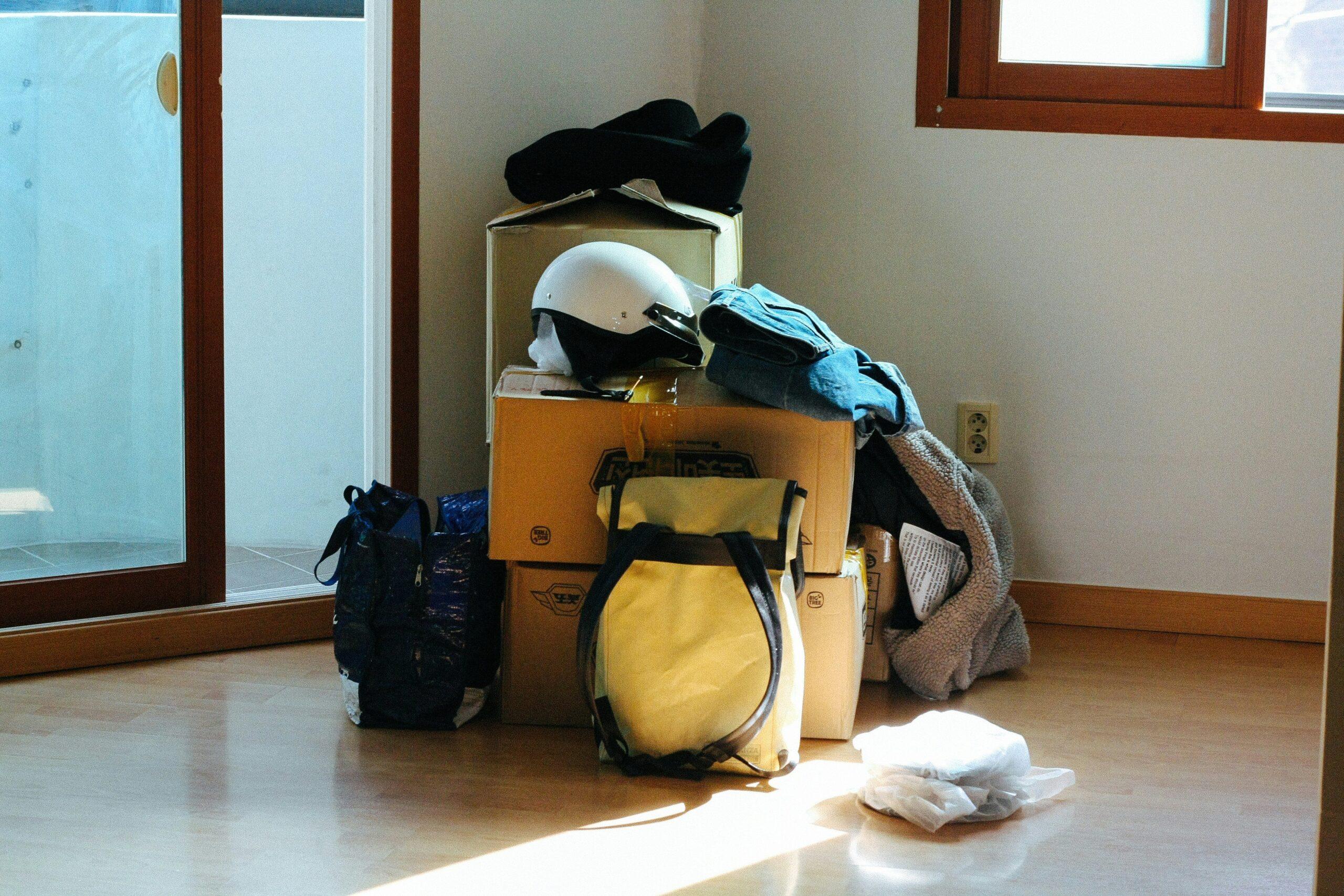 Pro surfer Jake holding his organized surfboard luggage with visible wax holders