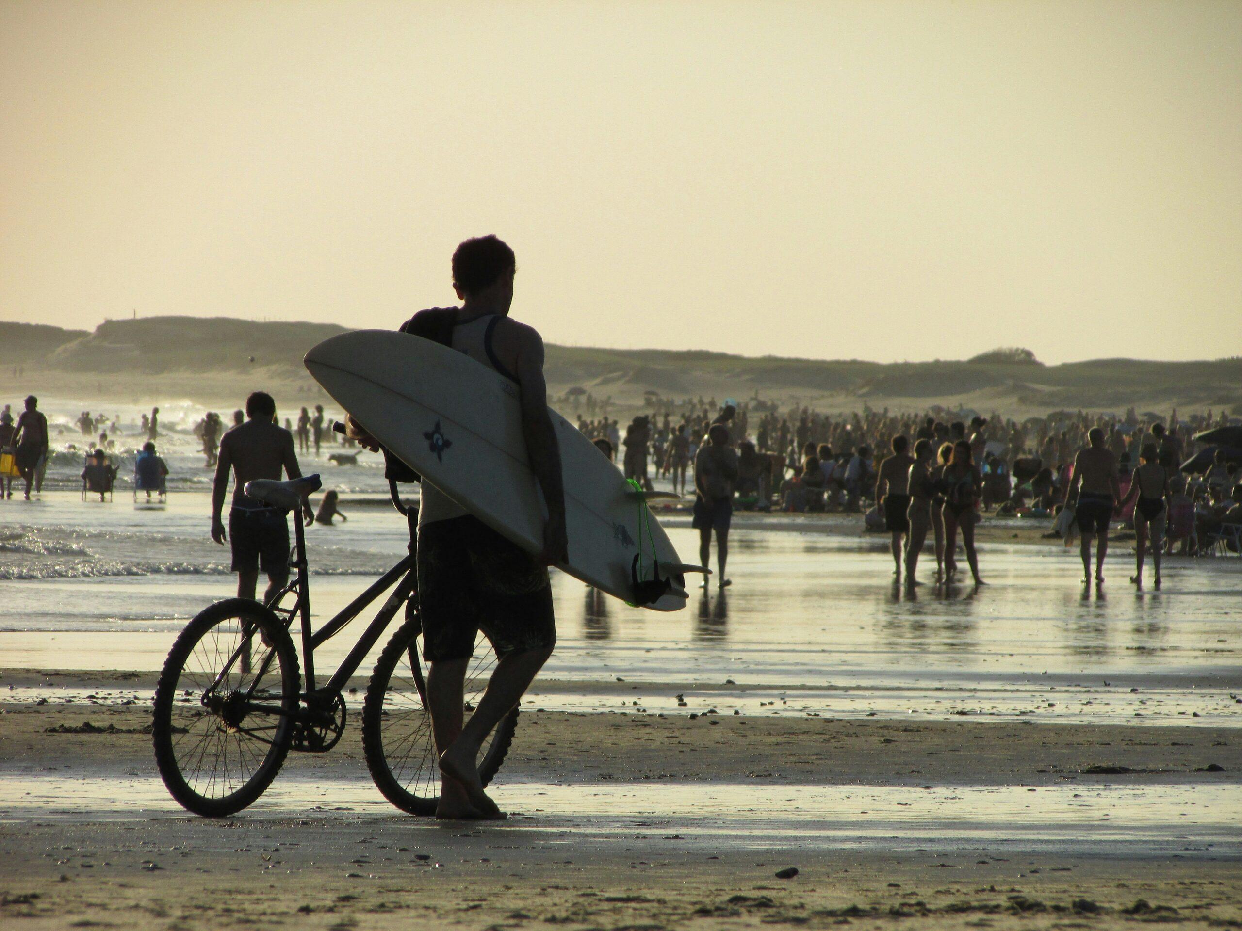 Surfboard Wobbling Dangerously Behind a Bike Rider