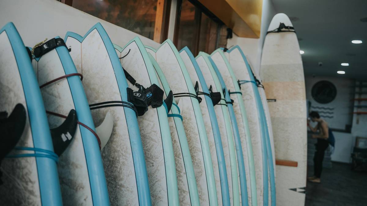 A damaged surfboard with cracks and scratches