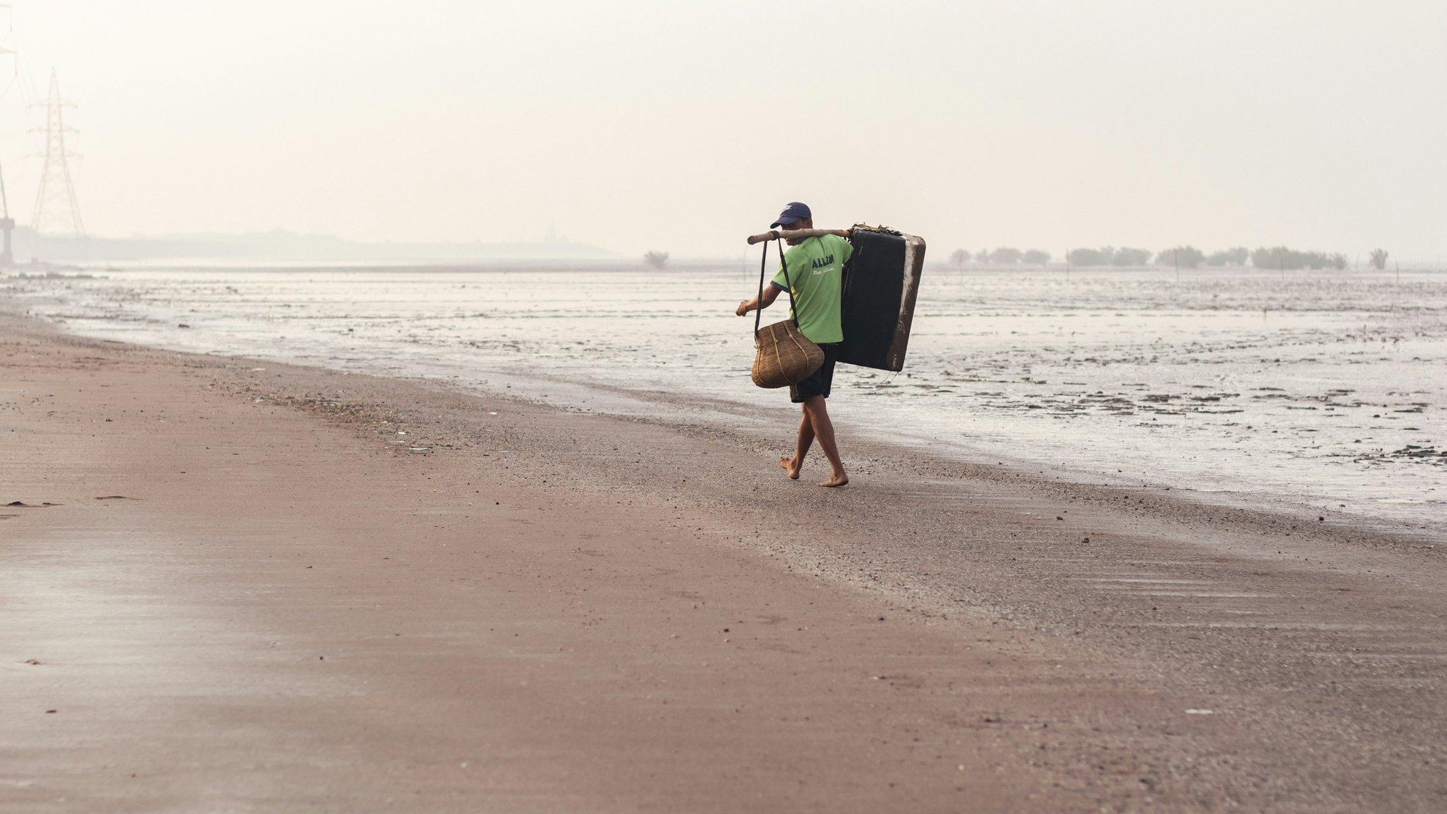 A high-quality surfboard travel bag with wheels and handles