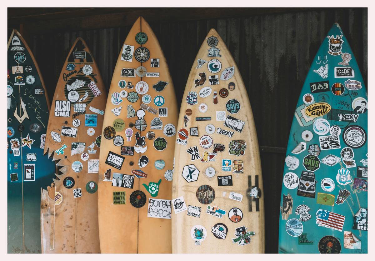 Labeled surfboard luggage at check-in counter