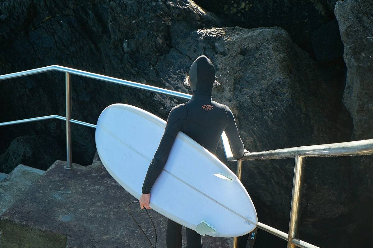 Waterproof surfboard bag with reinforced corners being displayed