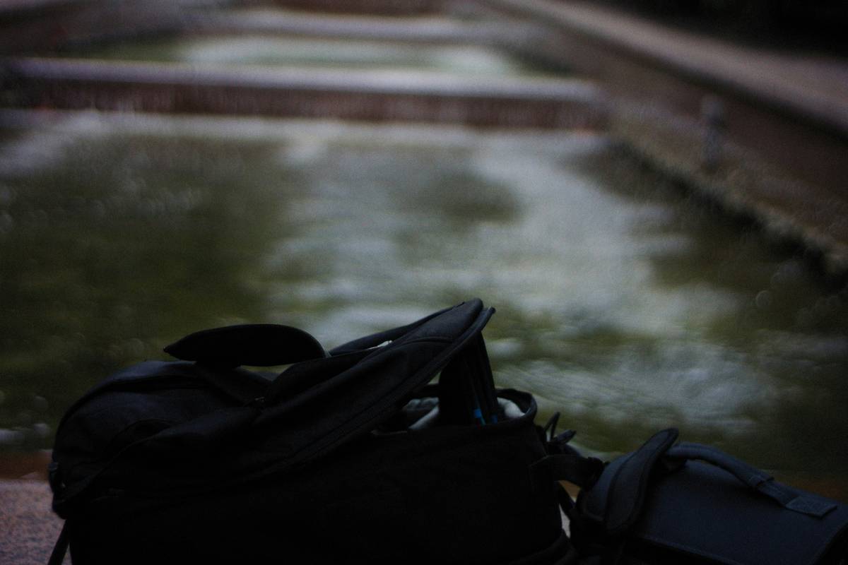 A padded surfboard travel bag being loaded onto a plane
