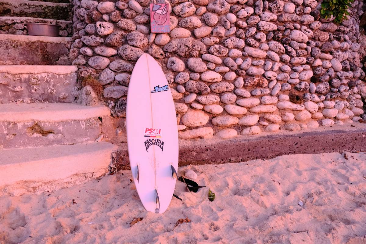 Close-up of a cracked surfboard due to mishandling at the airport