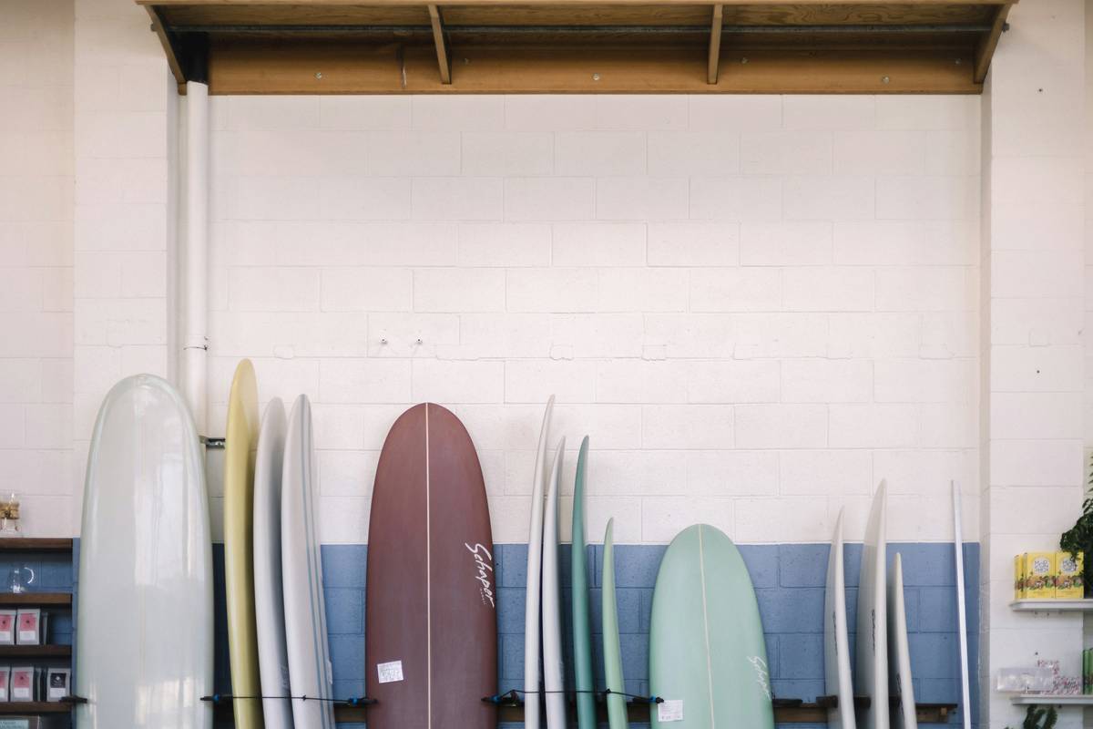 Surfboard luggage secured with a board vault lock system