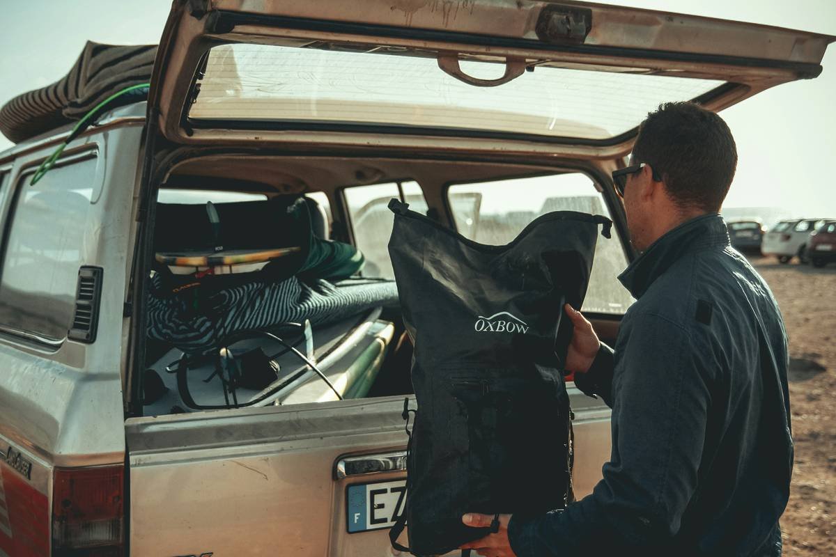 Wave shield surfboard is permanent in surfer's checked luggage at airport carousel